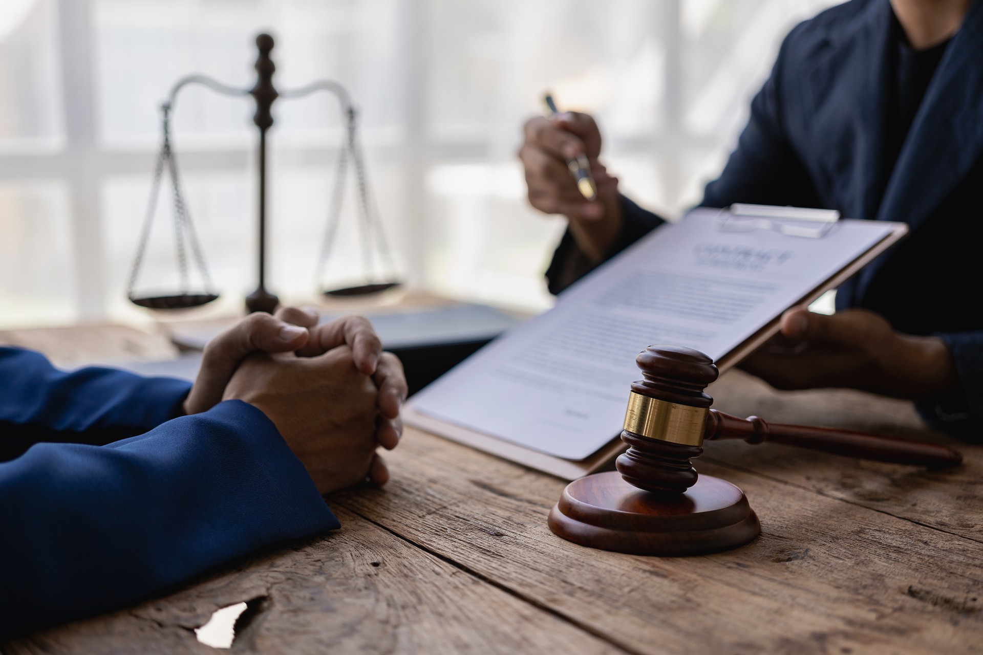 Lawyers provide legal advice. Represent clients in court and help with legal documents expert male lawyer discusses tax documents working in the office at a meeting legal consulting concept